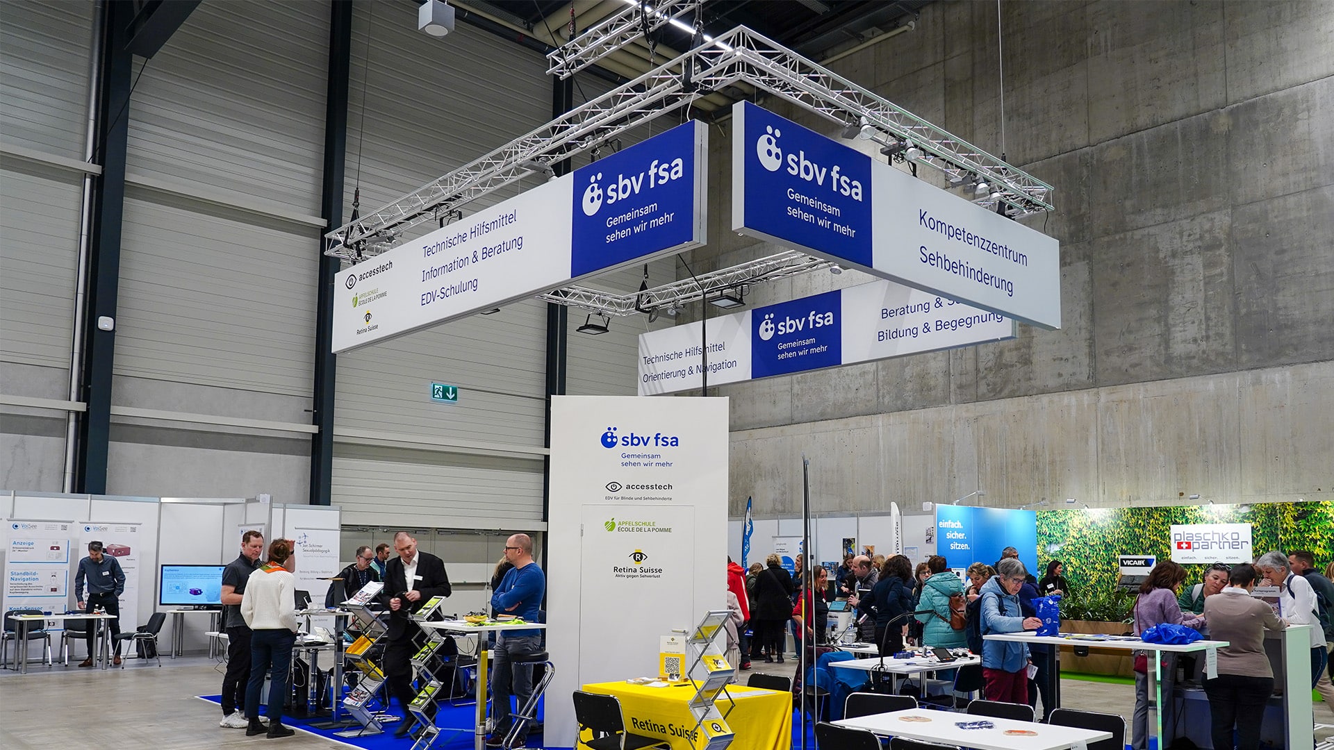 Aperçu du stand de SBV FSA avec des informations sur le conseil en aides techniques.