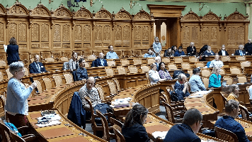 les participantes et participants au Palais fédéral
